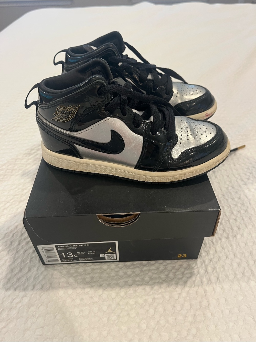 Nike Kids Jordan 1 mid, Black and Silver